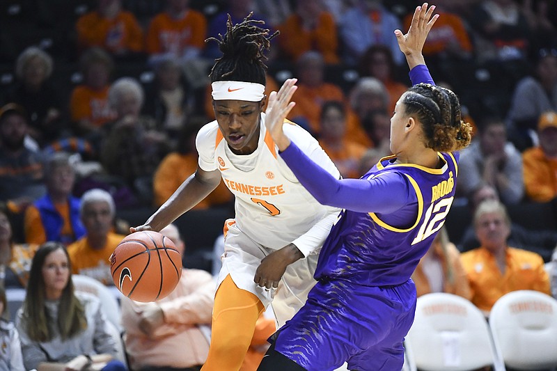 Tennessee's Rennia Davis is guarded by LSU's Mercedes Brooks during Sunday's game in Knoxville. Davis scored 30 points as the No. 23 Lady Vols won 63-58. / AP photo by Saul Young