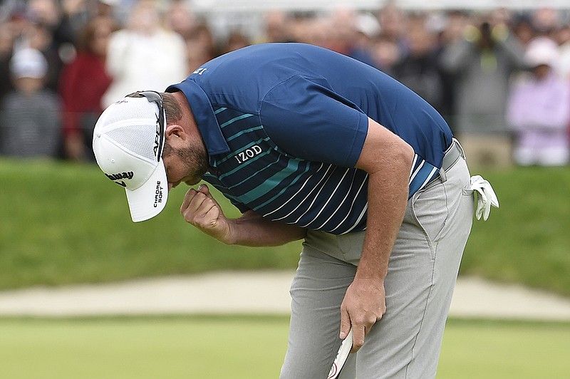 Marc Leishman pumps his fist on the 18th hole after making a birdie putt to finish a final-round 65 on the South Course at Torrey Pines in San Diego. Leishman won the Farmers Insurance Open by a stroke over Jon Rahm. / AP photo by Denis Poroy