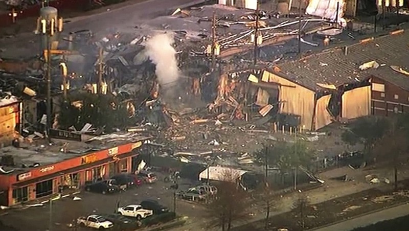 This aerial photo taken from video provided by KTRK-TV shows damage to buildings after an explosion in Houston on Friday, Jan. 24, 2020. A large explosion left rubble scattered in the area, damaged nearby homes and was felt for miles away. A fire continues to burn and people have been told to avoid the area. (KTRK-TV via AP)