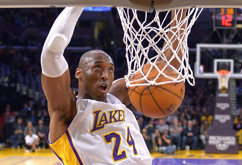 Los Angeles Lakers guard Kobe Bryant dunks during the first half of a game against the Indiana Pacers on Jan. 4, 2015, in Los Angeles. Bryant, a five-time NBA champion and a two-time Olympic gold medalist, died in a helicopter crash in California on Sunday. He was 41. / AP photo by Mark J. Terrill

