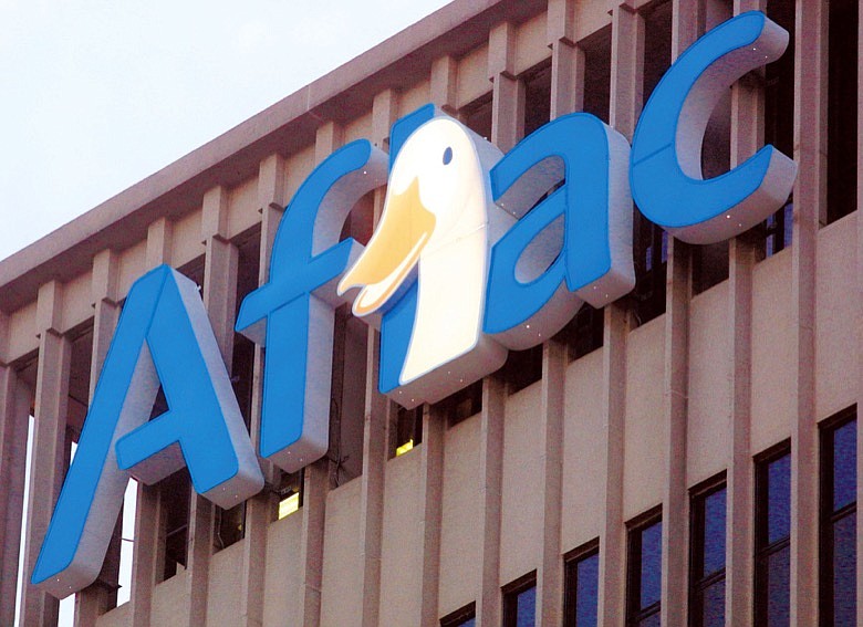 The Aflac duck looks out over Columbus, Ga., from atop the company headquarters building Saturday, Jan. 1, 2005. From a park bench in 1999 to a cameo appearance in a box office blockbuster five years later, the Aflac duck has turned the hard-to-pronounce company into a household name. Aflac, which celebrated its 50th anniversary in November, will continue to ride the duck's success in the new year. The Fortune 500 company added the cultural icon to its logo in December and are hoping to explain what Aflac actually does, now that most people have heard of Aflac. (AP Photo/Columbus Ledger-Enquirer, Philip Wartena)