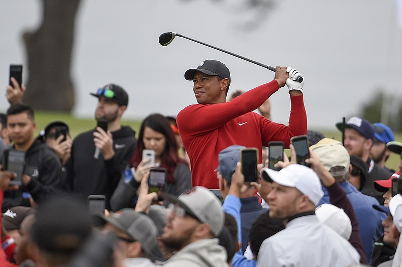 AP file photo by Denis Poroy / It's been almost 100 days since 15-time major champion Tiger Woods played golf in front of fans.