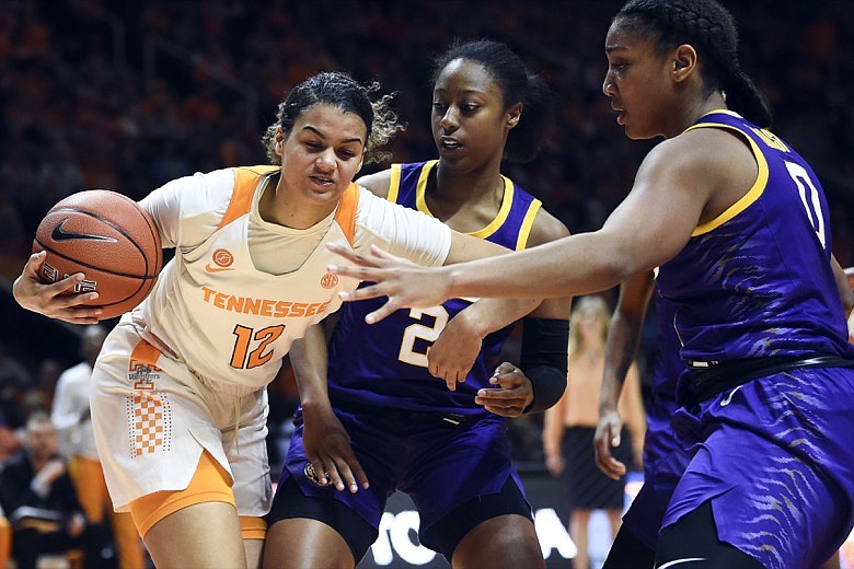 Tennessee guard/forward Rae Burrell (12) is guarded by LSU guard Tiara Young (2) and guard/forward Mercedes Brooks (12) during an NCAA college basketball game in Knoxville, Tenn., on Sunday, Jan. 26, 2020. (Saul Young/Knoxville News Sentinel via AP)