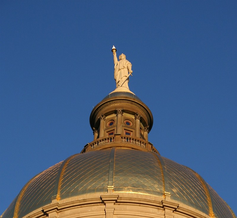 Detail shot of the statue atop the Georgia State Capitol Building in Atlanta. georgia senate tile capitol tile building / Getty Images
