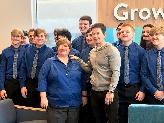 Mark Wahlberg visits with members of the Gordon County Chorale who sang the National Anthem at Walmart's grand opening Wednesday in Calhoun, Georgia. Photo courtesy of John Engleman, Mitchell Communication