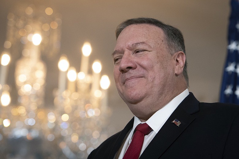Secretary of State Mike Pompeo pauses as he meets with Benin President Patrice Talon at the State Department. in Washington, Tuesday, Jan. 28, 2020. (AP Photo/Cliff Owen)