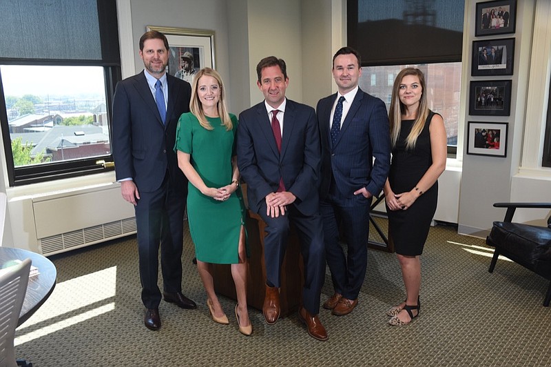 Staff photo by Tim Barber/ Todd Womack, center, heads up the firm of Bridge Public Affairs located in the Volunteer Building. From left are Brent Wiles, Micah Johnson, Womack, John Goetz and Presley Nixon.
