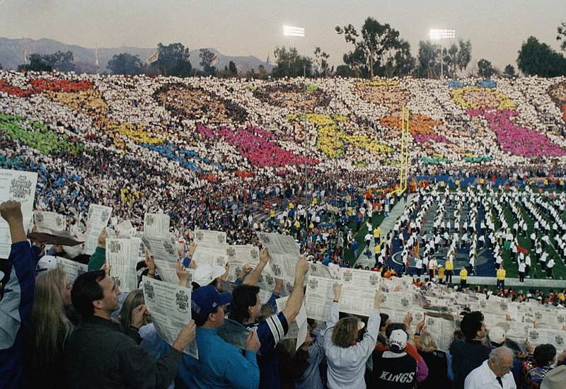 The production company responsible for the huge Super Bowl XXVII halftime shows enlisted the help of more than 10,000 people in attendance to raise colored cards to create a mosaic of children throughout the stadium in Pasadena, Calif., Feb. 1, 1993. (AP Photo/Susan Walsh)