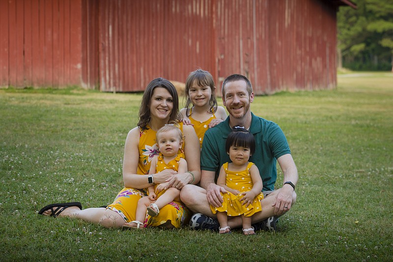 Photo by Ashworth Photography / Scott Hagie and wife Beth took advantage of a Unum adoption benefit to help defray expenses relating to Charlotte, sitting in Scott's lap, joining their family. Their other children are Reagan, back, and Chloe.