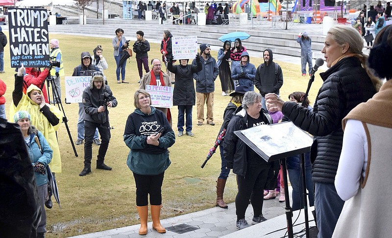 Staff Photo by Robin Rudd / Allison Smith, far left, and others heckle state Rep. Robin Smith as Smith introduces keynote speaker, Dr. Paula Casey at the Chattanooga Women's Rally 2020, held at Miller Park on Jan. 18, 2020.