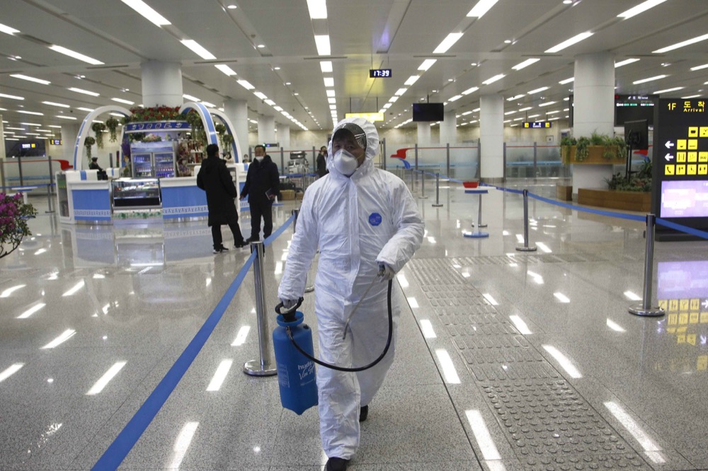 State Commission of Quality Management are checking up the health of members who return after business tour in foreign countries and inspecting and quarantining goods being delivered via the borders in a responsible way at the Pyongyang Airport in Pyongyang, DPRK, on Saturday, Feb., 1st, 2020. (AP Photo/Jon Chol Jin)