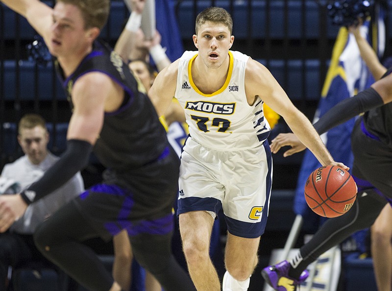 Staff photo by Troy Stolt / Chattanooga Mocs guard Matt Ryan (32) brings the ball down court after grabbing a rebound during the second half of the Chattanooga Mocs 61-64 loss against the Western Carolina Catamounts at Mckenzie Arena on Saturday, Feb. 1, 2020 in Chattanooga, Tenn..