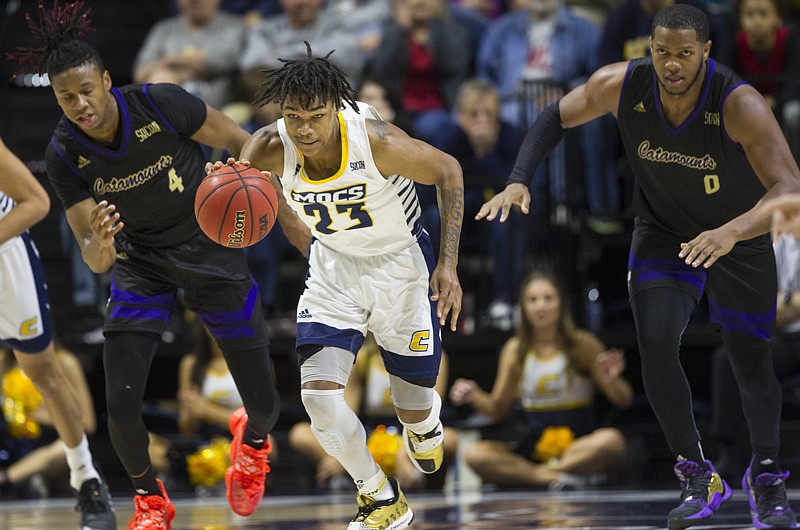 UTC guard Trey Doomes sprints downcourt after recovering a loose ball during the second half of the Mocs' home loss to Western Carolina on Saturday. / Staff photo by Troy Stolt