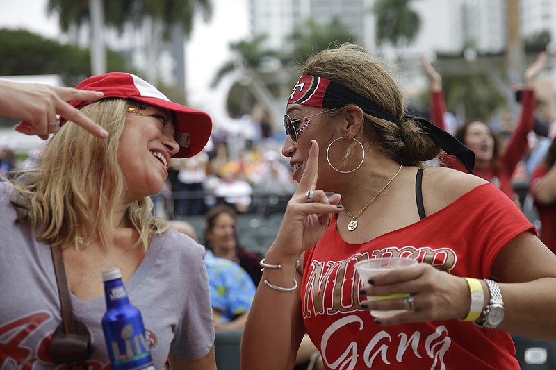 San Francisco 49ers fan Teleisia Fahy, right, and a friend celebrate during a rally on Saturday in Miami ahead of Super Bowl LIV on Sunday. The 49ers will take on the Kansas City Chiefs. / AP photo by Brynn Anderson