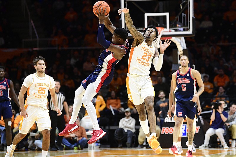 Tennessee's Jordan Bowden (23) and Ole Miss guard Bryce Williams go after the basketball on Jan. 21 at Thompson-Boling Arena in Knoxville. Taking advantage of opportunities to turn defense into offense with good transition play is vital to the Vols as they try to offset their struggles with the interior game. / AP photo by Calvin Mattheis