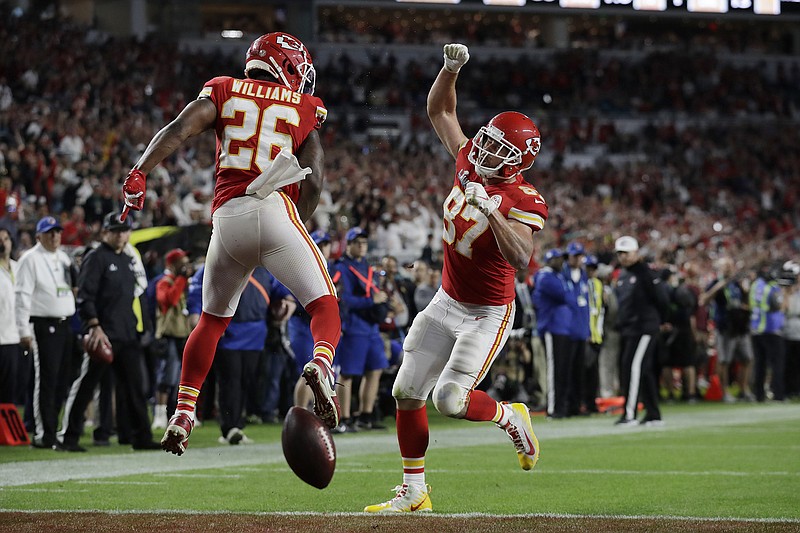 Kansas City Chiefs tight end Travis Kelce (87) celebrates his touchdown with teammate Damien Williams during the second half of Super Bowl LIV on Sunday night in Miami Gardens, Fla. / AP photo by Lynne Sladky