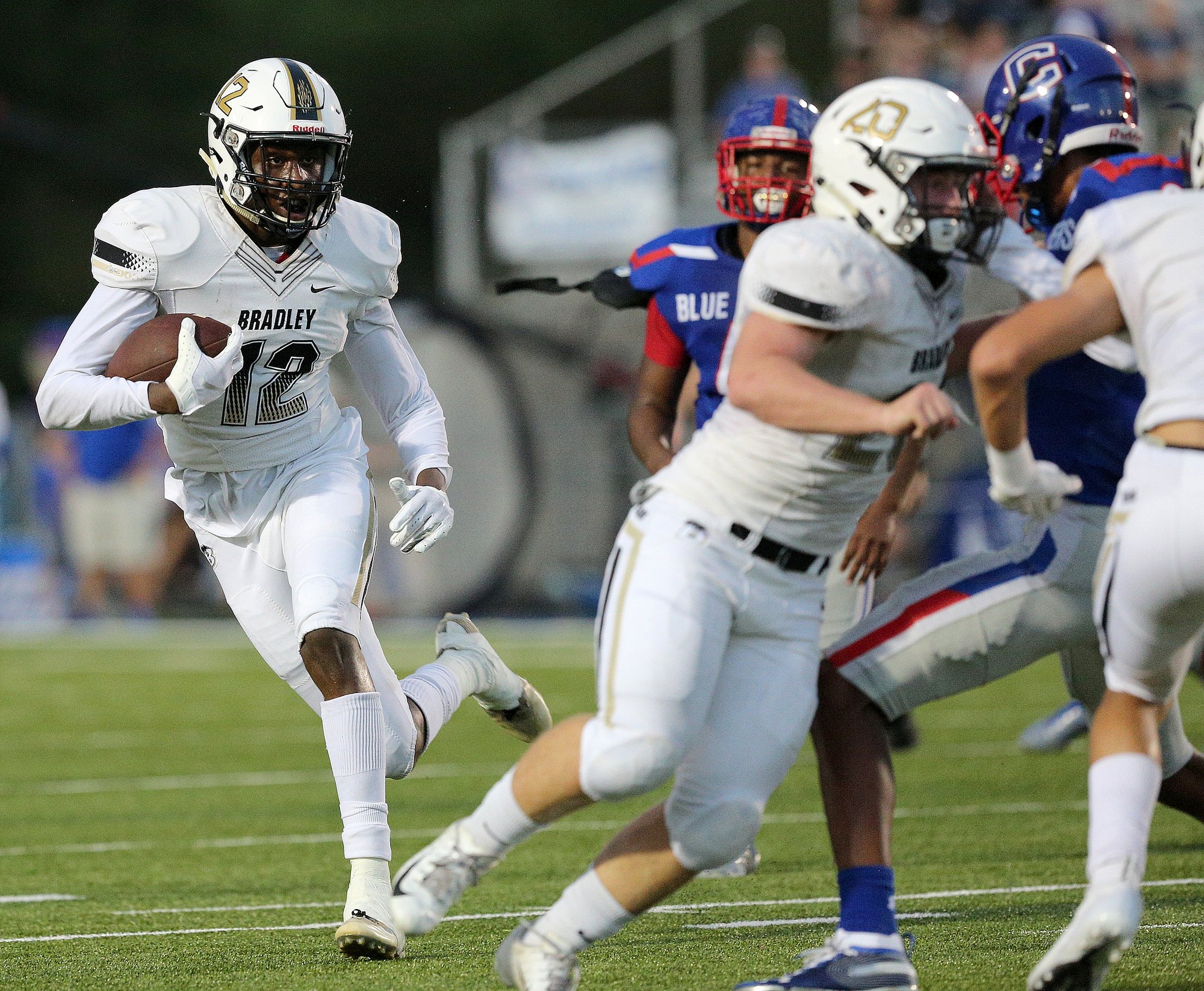 Bradley Central wide receiver Tray Curry (12) runs the ball downfield during the Bradley Central vs. Cleveland football game at Raider Field at Cleveland High School Friday, September 14, 2018 in Cleveland, Tennessee. Bradley Central was leading 14-7 at the half.