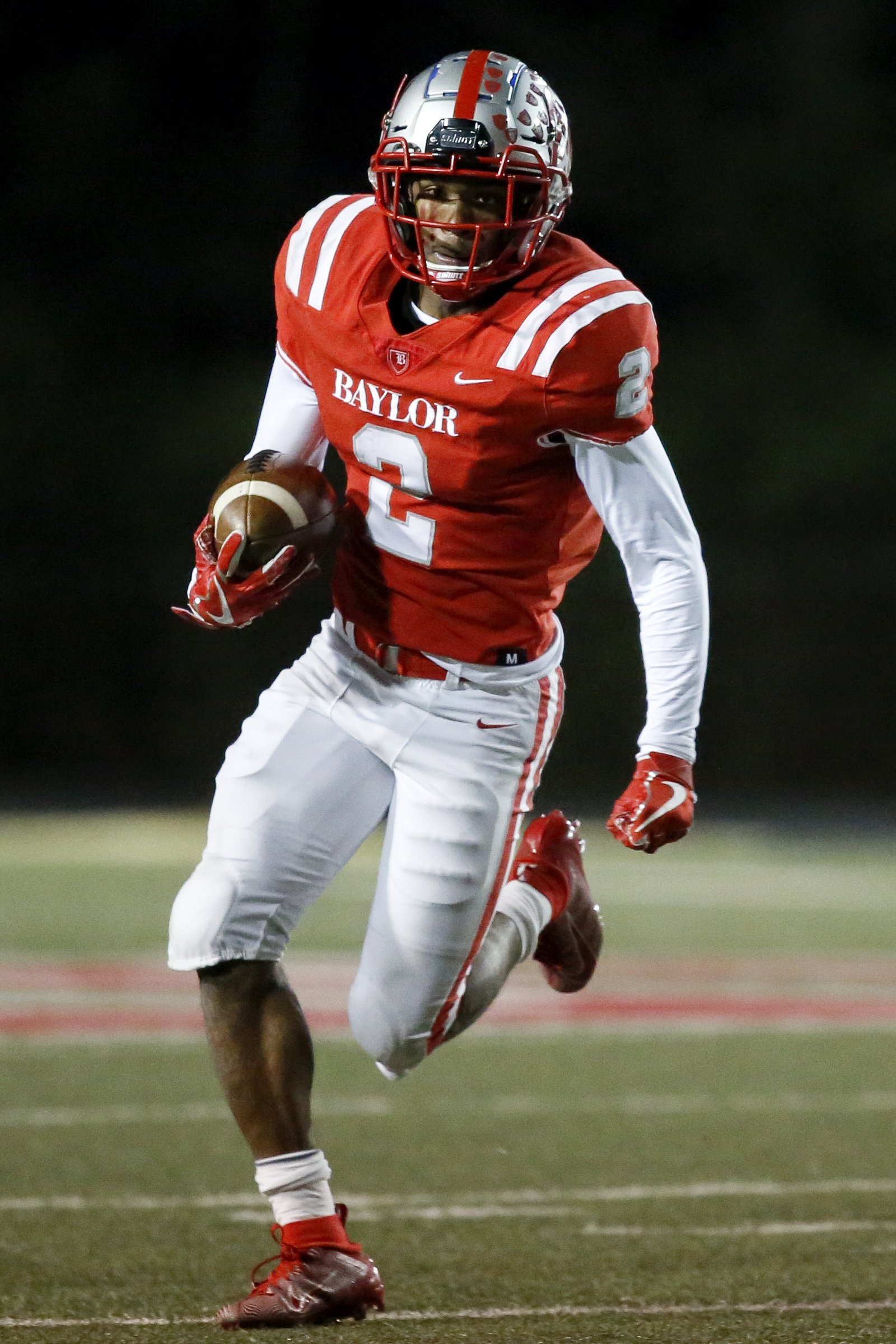 Staff photo by C.B. Schmelter / Baylor's Elijah Howard (2) runs with the ball against MBA during the Division II-AAA quarterfinals at Heywood Stadium on the campus of Baylor School on Friday, Nov. 15, 2019 in Chattanooga, Tenn.