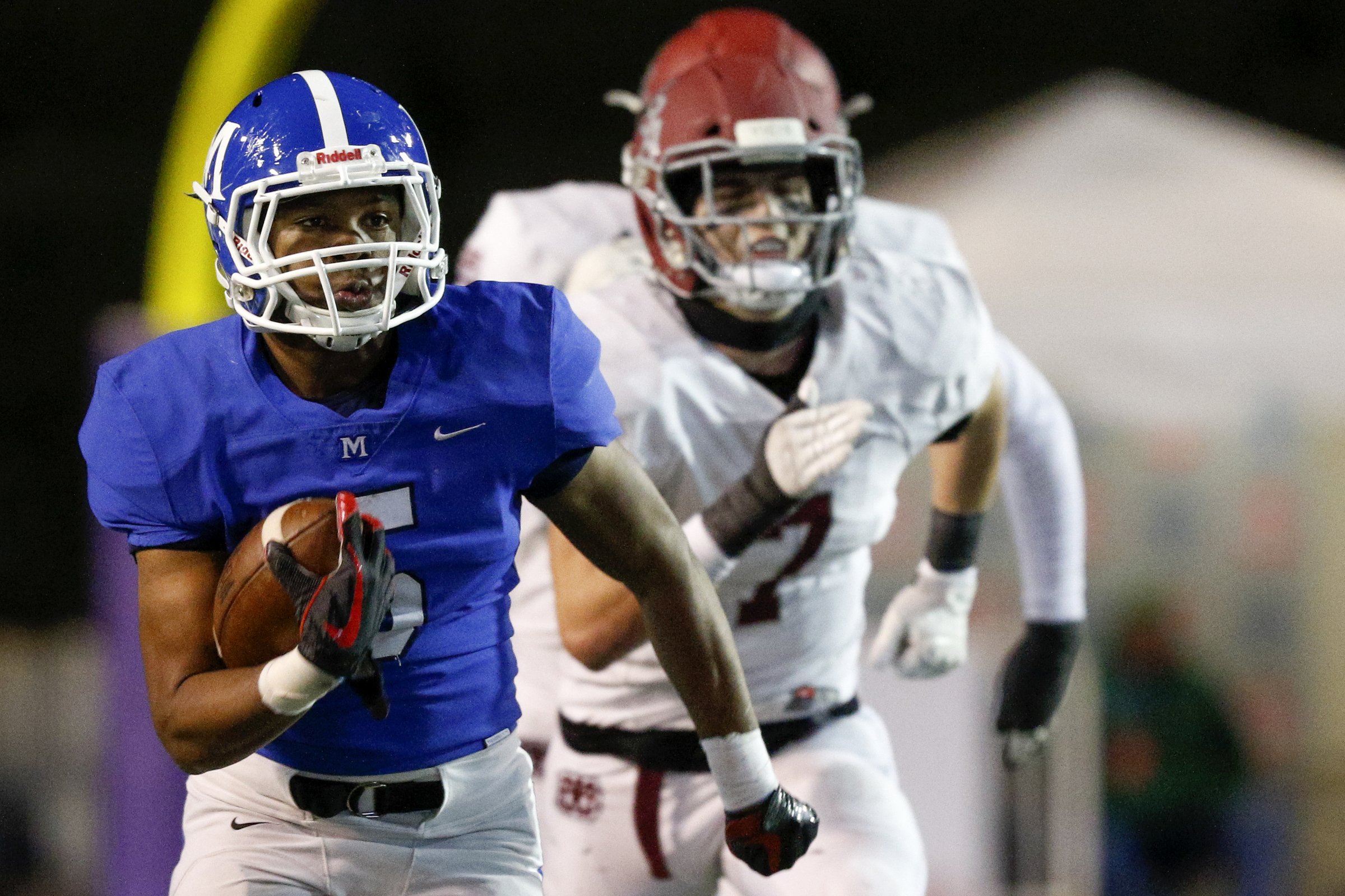 Staff photo by C.B. Schmelter / McCallie's B.J. Harris (5) rushes for a 49-yard gain against MBA during the Division II-AAA BlueCross Bowl state championship at Tennessee Technological University's Tucker Stadium on Thursday, Dec. 5, 2019 in Cookeville, Tenn.