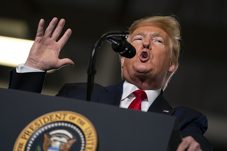 In this Jan. 28, 2020, file photo, President Donald Trump speaks during a campaign rally at the Wildwoods Convention Center Oceanfront in Wildwood, N.J. Trump will be facing his accusers Tuesday night during his State of the Union speech. The impeached president is speaking on the eve of what's anticipated to be his Senate acquittal on Wednesday. (AP Photo/ Evan Vucci, File)