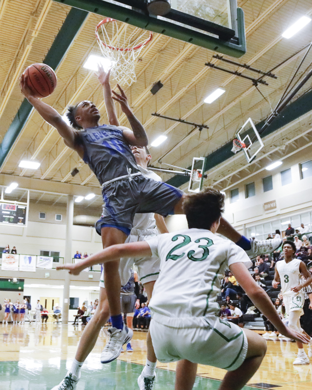 Staff photo by Troy Stolt / Cleveland's JaCobi Wood (10) goes up for a layup during the boys basketball game between Cleveland and East Hamilton at East Hamilton high school on Tuesday, Feb. 4, 2020 in Chattanooga, Tenn..