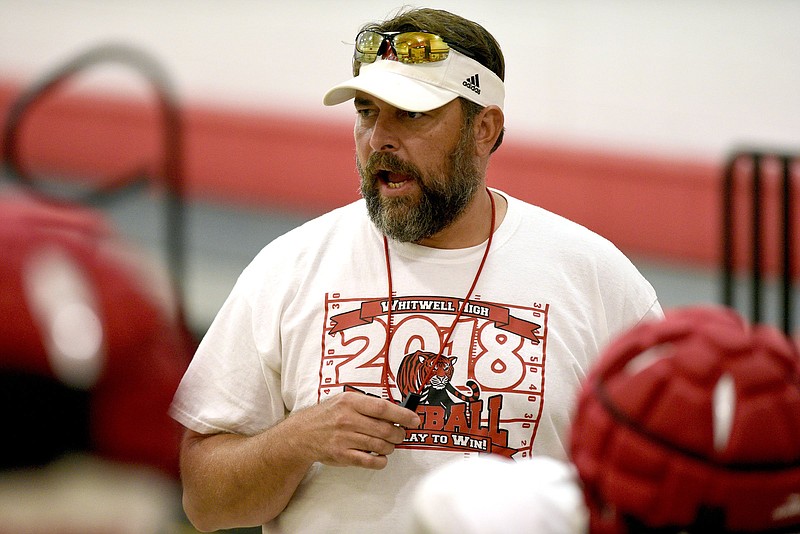 Travis Olinger works with Whitwell's offensive line last August. Olinger was head coach of the Tigers last season after being a defensive assistant on the 2018 team that won the Class 1A state title, but he has been fired after going 3-9 in his lone year in charge. / Staff photo by Robin Rudd