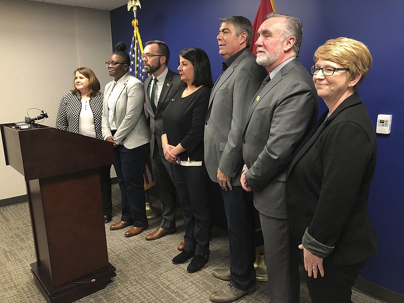 LGBT advocacy group leaders and representatives from businesses gathered at the Cordell Hull legislative building in Nashville on Wednesday, Feb. 5, 2020 for a news conference to oppose a state adoption law and other proposals that target the LGBT community. Almost three dozen big companies and more than 100 small businesses in Tennessee on Wednesday predicted economic backlash from a newly enacted state adoption law and other proposals that target LGBT people, with one company saying plans to add jobs in Nashville are "in doubt" over the legislation. (AP Photo/Jonathan Mattise)