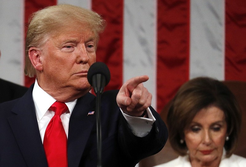 President Donald Trump delivers his State of the Union address to a joint session of Congress in the House Chamber on Capitol Hill in Washington, Tuesday, Feb. 4, 2020, as Nancy Pelosi listens. (Leah Millis/Pool via AP)


