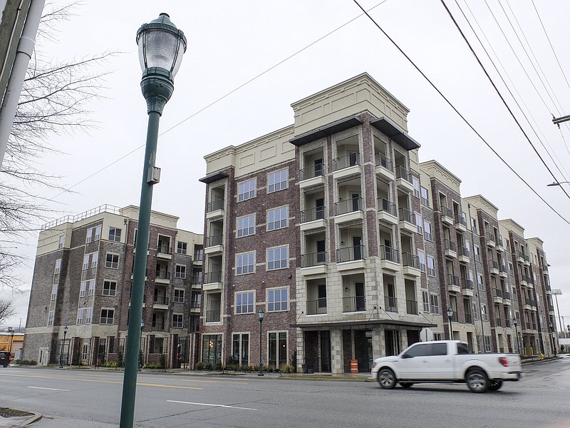 Staff photo by Tim Barber/ The new apartment complex on Broad Street in downtown Chattanooga is a $35 million project. It borders 17th Street and the 50-year-old Pilgrim's Pride poultry plant.