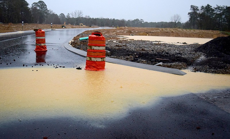 Staff Photo by Robin Rudd / Storm water runs off a construction site on Julian Road in East Brainerd.  Heavy rain and flooding forced the closing of some local school systems on February 6, 2020.