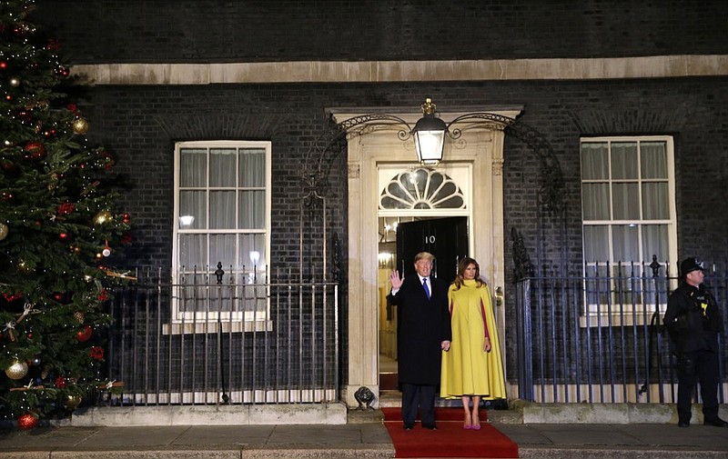 FILE - In this Dec. 3, 2019, file photo, U.S. President Donald Trump and first lady Melania arrive at 10 Downing Street in London ahead of a NATO reception hosted by British Prime Minister Boris Johnson. (AP Photo/Alastair Grant, Pool, File)

