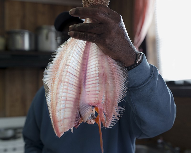 John Lusk Hathaway, "Backman's Seafood" from the series "Archaeology of Water," 2013, Archival pigment print, 16x30. Courtesy of the artist.