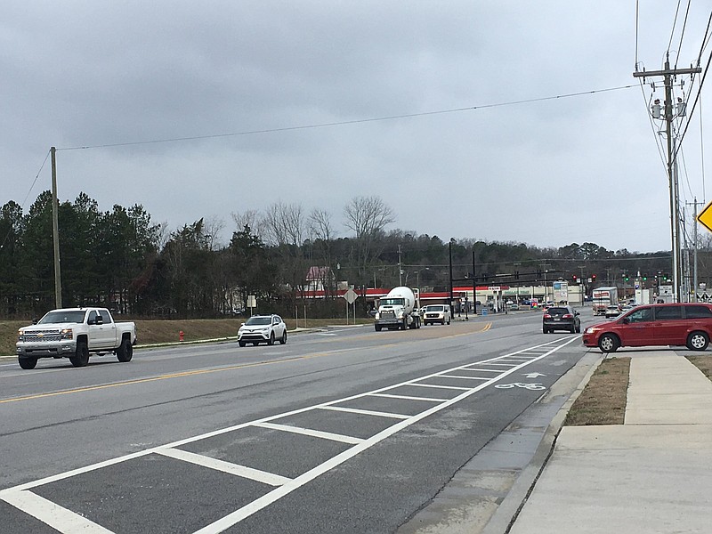 Staff photo by Kim Sebring / Traffic moves on a portion of Apison Pike leading into the heart of Collegedale. The third stage of widening a 3.4-mile stretch of the road will begin next month