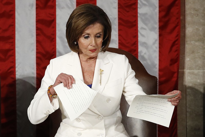 Photo by Patrick Semansky of The Associated Press / House Speaker Nancy Pelosi of California, tears her copy of President Donald Trump's State of the Union address after he delivered it to a joint session of Congress on Capitol Hill in Washington on Tuesday, Feb. 4, 2020.