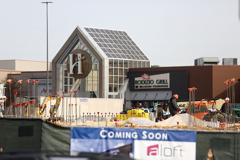 Staff file photo / Construction is underway at Hamilton Place mall in front of what was formerly Sears to make way for new retailers and other users.