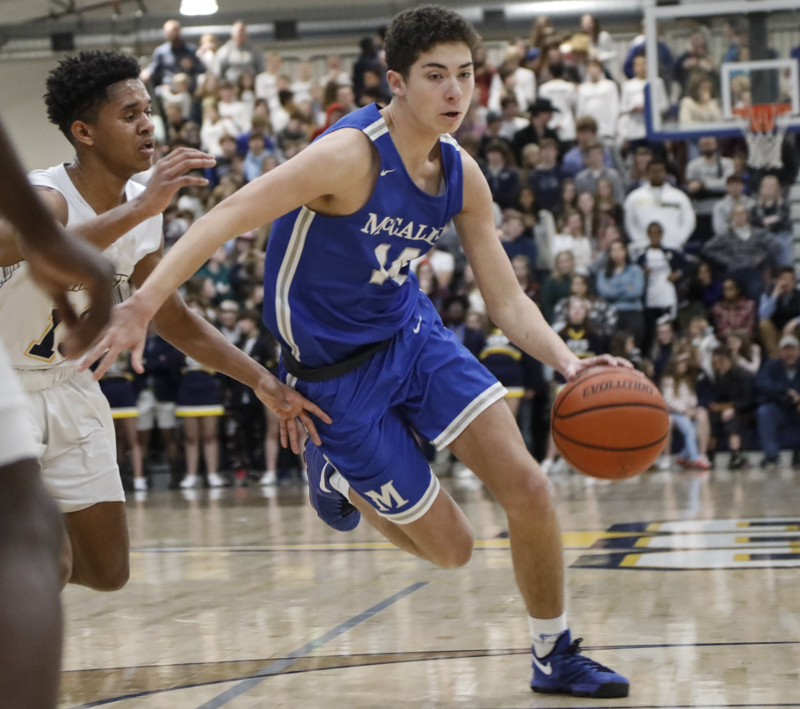 Staff photo by Troy Stolt / McCallie's Wilson Rankin (14) drives the ball to the basket during the boy's basketball game between Chattanooga Christian and McCallie at Chattanooga Christian on Friday, Feb. 7, 2020 in Chattanooga, Tenn.