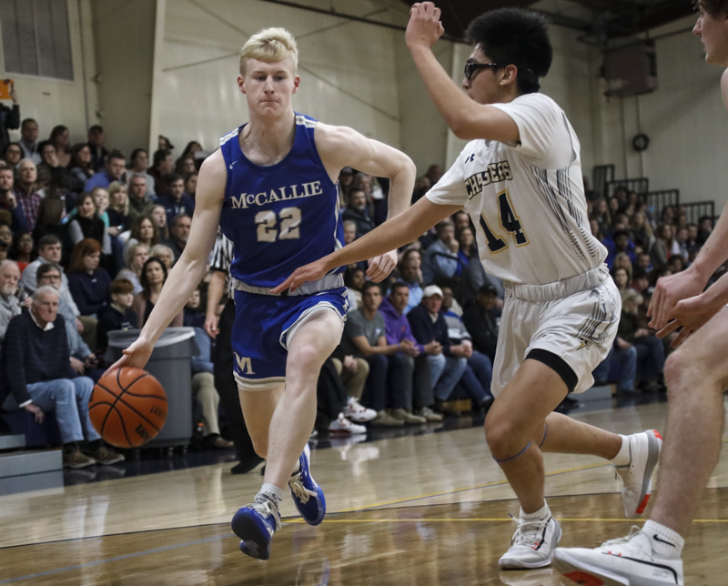 Staff photo by Troy Stolt / McCallie's Trey Hamilton (22) drives the ball into the paint during the boy's basketball game between Chattanooga Christian and McCallie at Chattanooga Christian on Friday, Feb. 7, 2020 in Chattanooga, Tenn.