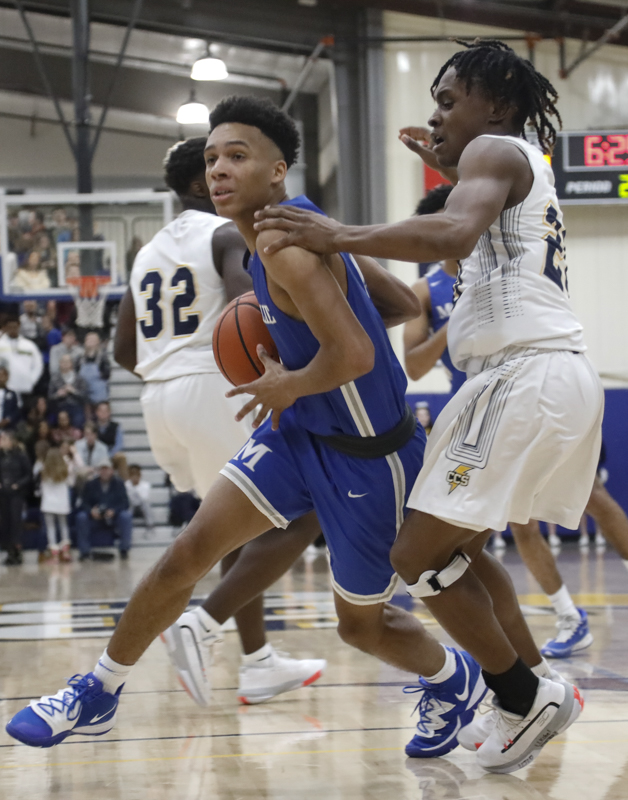 Staff photo by Troy Stolt / McCallie's Eric Rivers (1) drives the ball to the basket during the boy's basketball game between Chattanooga Christian and McCallie at Chattanooga Christian on Friday, Feb. 7, 2020 in Chattanooga, Tenn.