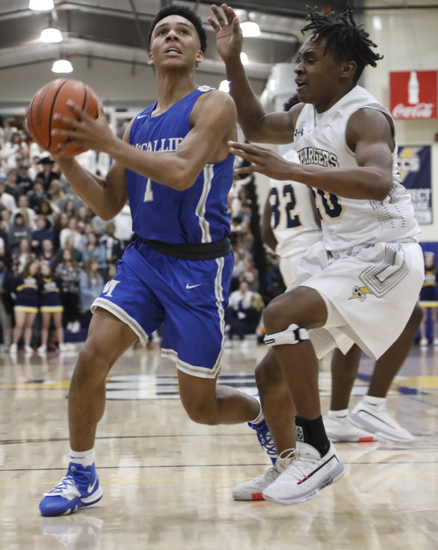 Staff photo by Troy Stolt / McCallie's Eric Rivers (1) prepares to put up a shot in Friday's 59-53 win at Chattanooga Christian. Rivers scored 19 points.