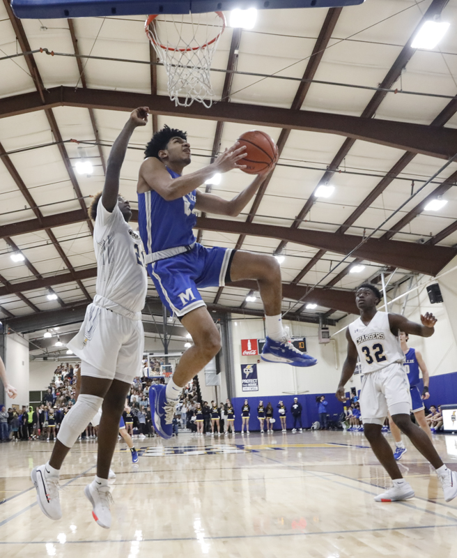 Staff photo by Troy Stolt / McCallie's Joryam Saizonou (2) lays the ball up during the boy's basketball game between Chattanooga Christian and McCallie at Chattanooga Christian on Friday, Feb. 7, 2020 in Chattanooga, Tenn.