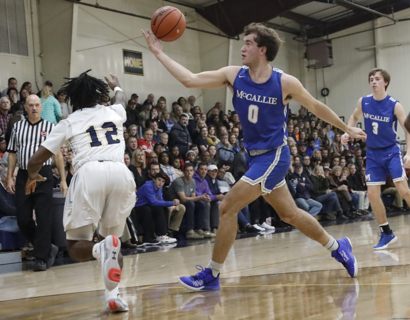 Staff photo by Troy Stolt / McCallie's Spencer Turner (0) grabs a loose ball during the boy's basketball game between Chattanooga Christian and McCallie at Chattanooga Christian on Friday, Feb. 7, 2020 in Chattanooga, Tenn.
