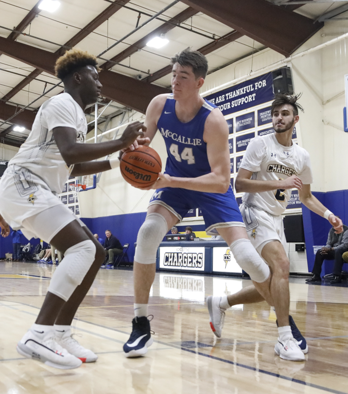 Staff photo by Troy Stolt / McCallie's David Craig (44) loses the ball to Chattanooga Christian's Michael Houge (21) during the boy's basketball game between Chattanooga Christian and McCallie at Chattanooga Christian on Friday, Feb. 7, 2020 in Chattanooga, Tenn.