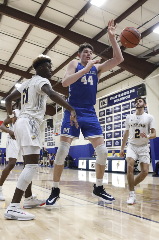 Staff photo by Troy Stolt / McCallie's David Craig (44) loses the ball to Chattanooga Christian's Michael Houge (21) during the boy's basketball game between Chattanooga Christian and McCallie at Chattanooga Christian on Friday, Feb. 7, 2020 in Chattanooga, Tenn.