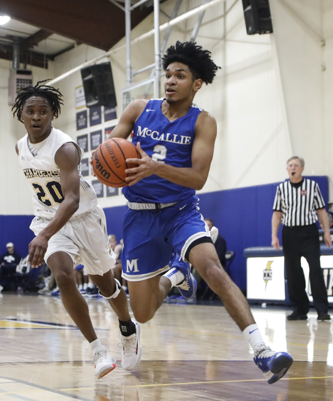 Staff photo by Troy Stolt / McCallie's Joryam Saizonou (2) drives to the basket during the boy's basketball game between Chattanooga Christian and McCallie at Chattanooga Christian on Friday, Feb. 7, 2020 in Chattanooga, Tenn.