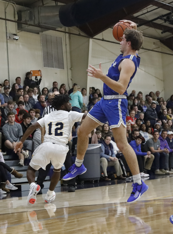 Staff photo by Troy Stolt / McCallie's Spencer Turner (0) grabs a loose ball during the boy's basketball game between Chattanooga Christian and McCallie at Chattanooga Christian on Friday, Feb. 7, 2020 in Chattanooga, Tenn.