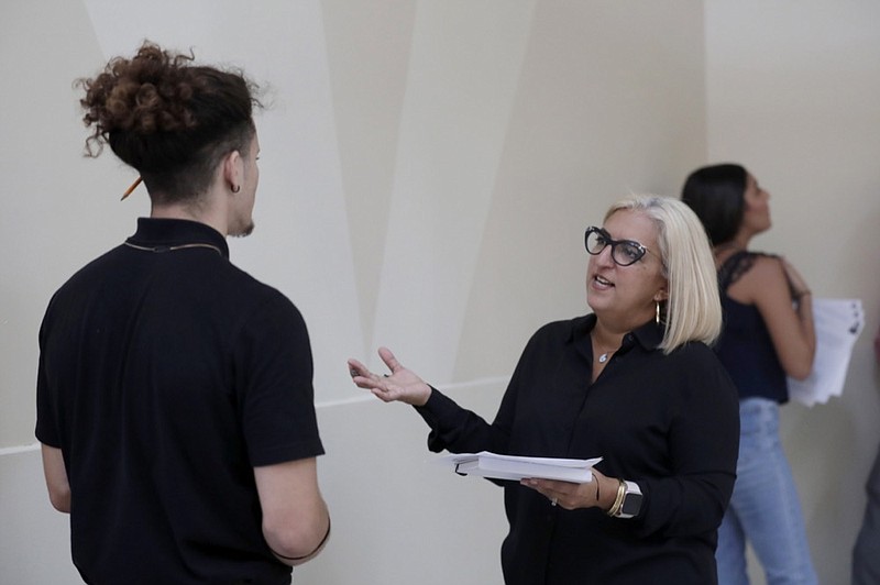 FILE - In this Oct. 1, 2019, file photo, Gory Rodriguez, of Starbucks, right, interviews a job applicant during a job fair at Dolphin Mall in Miami. AP Photo/Lynne Sladky, File)


