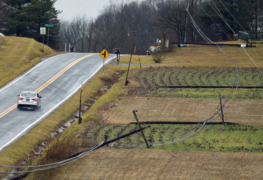 Power poles snapped off along New Chapel Road in severe weather near Westminster, Md. (Jerry Jackson/The Baltimore Sun via AP)