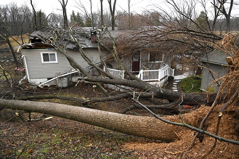 Several trees fell on a home and property on Overbrook Drive in New Windsor, Md., Friday, Feb. 7, 2020, following a winter storm. (Jerry Jackson/The Baltimore Sun via AP)


