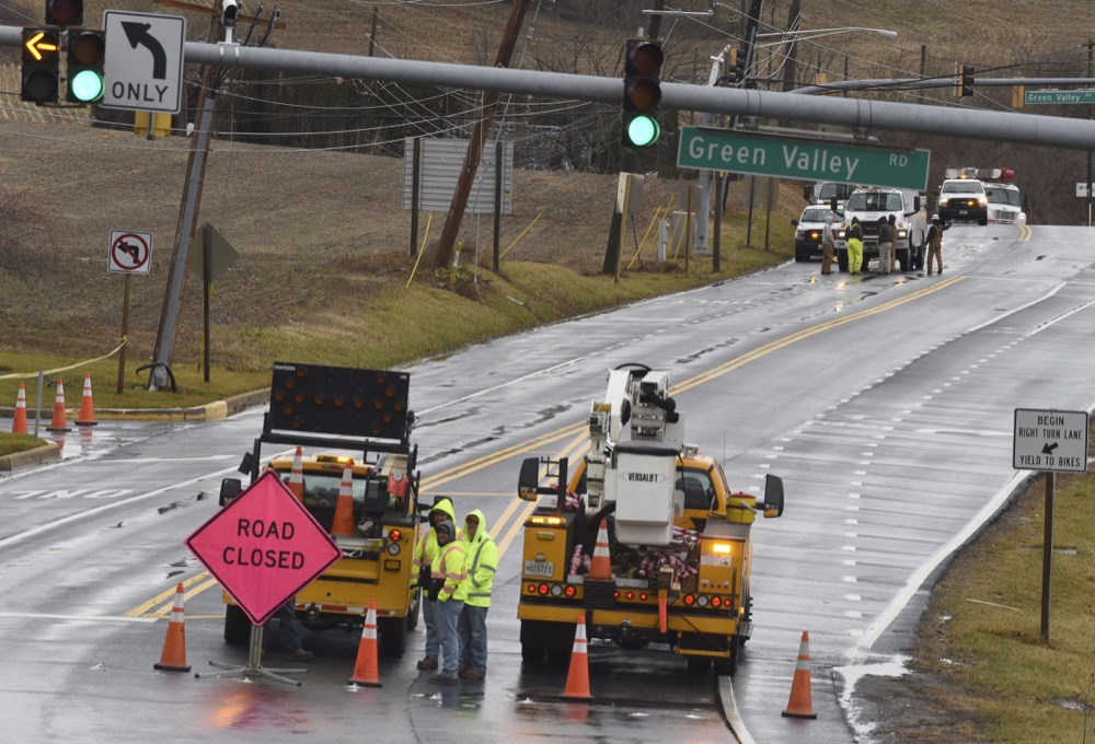 Crews work on power lines by the intersection of Routes 75 and 80 in Monrovia, Frederick County, Md., following severe weather on Friday, Feb. 7, 2020. (Brian Krista/The Baltimore Sun via AP)