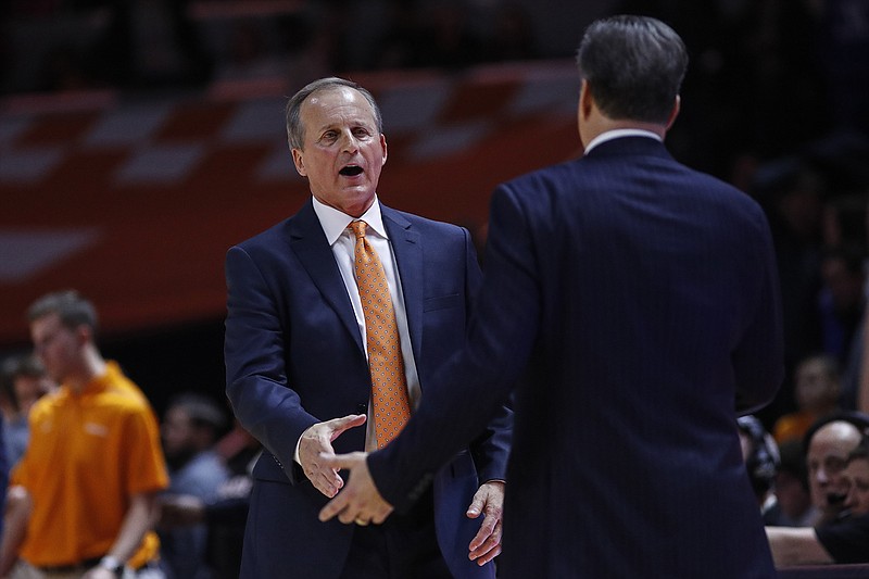 AP photo by Wade Payne / Tennessee men's basketball coach Rick Barnes, left, congratulates Kentucky counterpart John Calipari after Barnes' Vols lost 77-64 to Calipari's 15th-ranked Wildcats on Saturday at Thompson-Boling Arena.